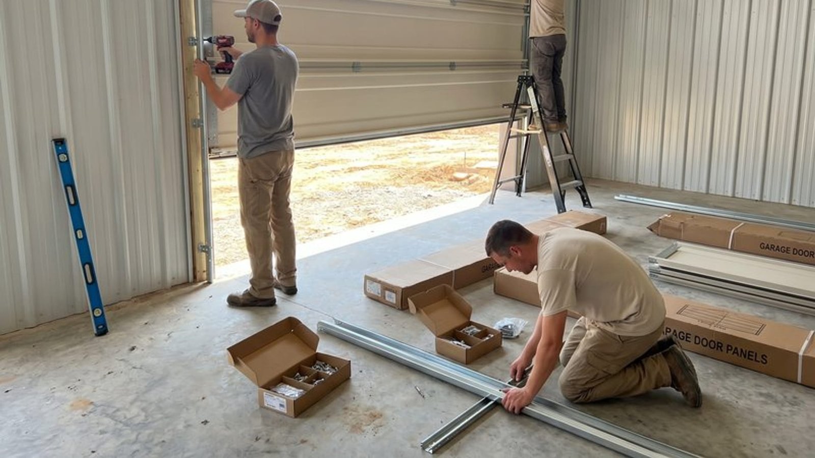 Track components laid out during a door installation